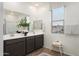 This main bathroom features a double sink vanity, large mirrors and mountain views at 4920 W Walatowa St, Laveen, AZ 85339
