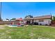 Lush backyard with a pool, patio, an umbrella, and outdoor furniture, perfect for entertaining at 5226 W Redfield Rd, Glendale, AZ 85306