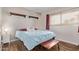 Bright bedroom with wood floors, a large window, and ample natural light at 5226 W Redfield Rd, Glendale, AZ 85306