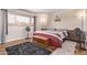 Cozy bedroom with hardwood floors, large window, and comfortable decor at 5226 W Redfield Rd, Glendale, AZ 85306
