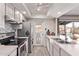 Bright kitchen featuring stainless steel appliances, ample counter space, and access to the backyard at 5226 W Redfield Rd, Glendale, AZ 85306