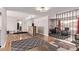 Open-concept living area with hardwood floors, stylish accents, and seamless flow to adjacent rooms at 5226 W Redfield Rd, Glendale, AZ 85306