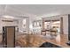Bright open layout with hardwood floors connecting living, dining, and kitchen areas for seamless entertaining at 5226 W Redfield Rd, Glendale, AZ 85306