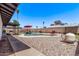 Backyard features a sparkling swimming pool, landscaping, and space for outdoor entertaining at 5226 W Redfield Rd, Glendale, AZ 85306