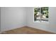 Empty bedroom with a large window allowing natural light at 5341 E Sheena Dr, Scottsdale, AZ 85254