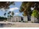 Eye-catching single-story home featuring desert landscaping, and modern architectural details at 5341 E Sheena Dr, Scottsdale, AZ 85254