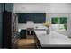 Modern kitchen with stainless steel appliances, a large island, custom cabinets, and elegant countertops at 5341 E Sheena Dr, Scottsdale, AZ 85254