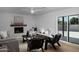 Cozy living room featuring a fireplace, wood floors, and natural light at 5341 E Sheena Dr, Scottsdale, AZ 85254