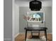 Bright home office with modern light fixture and outdoor views at 5341 E Sheena Dr, Scottsdale, AZ 85254