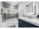 Modern bathroom showcases stylish gray and white tiling, sleek fixtures, and a glass shower at 5401 N 25Th St, Phoenix, AZ 85016