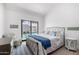 Charming bedroom with a comfortable bed and poolside views through sliding doors, offering a serene retreat at 5401 N 25Th St, Phoenix, AZ 85016