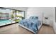Bright bedroom with a cozy bed, poolside views, and a private outdoor retreat for relaxation and rejuvenation at 5401 N 25Th St, Phoenix, AZ 85016