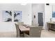 Dining area boasts modern decor, seating for six and art on walls at 5401 N 25Th St, Phoenix, AZ 85016