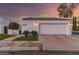 Contemporary home featuring a clean white exterior, an attached garage, and meticulously landscaped front yard at 5401 N 25Th St, Phoenix, AZ 85016