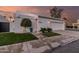 Modern home with a crisp white exterior, manicured lawn, and a convenient attached two-car garage, enhancing curb appeal at 5401 N 25Th St, Phoenix, AZ 85016