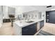 Bright kitchen with a large marble island, stainless steel appliances, and modern cabinets, perfect for entertaining at 5401 N 25Th St, Phoenix, AZ 85016