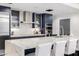 Modern kitchen with quartz counters, stainless steel appliances, and bar seating at 5401 N 25Th St, Phoenix, AZ 85016