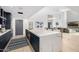 Open-concept kitchen featuring a large marble island, sleek cabinetry, and a seamless transition to the living area at 5401 N 25Th St, Phoenix, AZ 85016