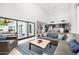 Spacious living room flows into the kitchen and features hardwood floors and large sliding glass doors at 5401 N 25Th St, Phoenix, AZ 85016
