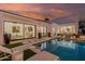Stunning backyard pool oasis featuring stylish lounge chairs and lush landscaping for ultimate relaxation and recreation at 5401 N 25Th St, Phoenix, AZ 85016