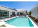 Backyard oasis featuring a modern pool, comfortable lounge area, and beautiful architectural details for elegant outdoor living at 5401 N 25Th St, Phoenix, AZ 85016