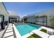 Inviting pool area with sleek tile, stylish patio furniture, and pristine landscaping, perfect for outdoor relaxation at 5401 N 25Th St, Phoenix, AZ 85016