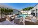 Stunning backyard features a pool, patio furniture, and a built-in gas fire pit at 5401 N 25Th St, Phoenix, AZ 85016