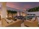 Inviting backyard pool area with comfortable seating, a fire pit, and stylish landscaping for relaxation and entertaining at 5401 N 25Th St, Phoenix, AZ 85016