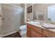 Modern bathroom with a glass shower and tan vanity at 6133 W Fetlock Ter, Phoenix, AZ 85083