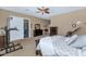 Comfortable bedroom with dresser, closet, and access to the outdoors at 6133 W Fetlock Ter, Phoenix, AZ 85083