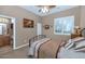 Cozy bedroom with a metal frame bed, and ensuite bathroom at 6133 W Fetlock Ter, Phoenix, AZ 85083