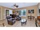 Inviting living room with comfortable leather chairs, bar area, and natural light at 6133 W Fetlock Ter, Phoenix, AZ 85083