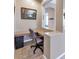 Cozy office nook with built-in desk, neutral colors, and ample lighting at 6133 W Fetlock Ter, Phoenix, AZ 85083