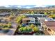 Aerial view highlighting a modern home with a hot tub, fire pit, outdoor seating, and lush landscaping at 6525 E Cave Creek Rd # 40, Cave Creek, AZ 85331