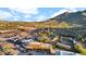 An aerial view of a desert mountain community with restaurants, parking and entertainment venues at 6525 E Cave Creek Rd # 40, Cave Creek, AZ 85331