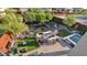 Inviting backyard with desert landscaping, artificial turf, seating around a firepit, and a hot tub at 6525 E Cave Creek Rd # 40, Cave Creek, AZ 85331