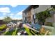 Stylish outdoor patio and backyard with modern furniture, a fire pit, and lush landscaping at 6525 E Cave Creek Rd # 40, Cave Creek, AZ 85331