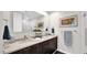 Modern bathroom showcasing double sinks, dark wood cabinets, and a large mirror at 6525 E Cave Creek Rd # 40, Cave Creek, AZ 85331