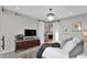 Charming bedroom features a decorative chandelier and sliding barn door leading to bathroom at 6525 E Cave Creek Rd # 40, Cave Creek, AZ 85331
