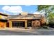 Modern home featuring sleek architectural design, a stylish black garage door, and professionally landscaped desert surroundings at 6525 E Cave Creek Rd # 40, Cave Creek, AZ 85331