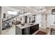 Gourmet kitchen featuring a large island, pendant lighting, stainless steel appliances, and an open view of the living area at 6525 E Cave Creek Rd # 40, Cave Creek, AZ 85331