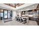 Stylish kitchen boasting a large island with bar seating, pendant lights, dark cabinetry, and granite countertops at 6525 E Cave Creek Rd # 40, Cave Creek, AZ 85331