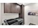 Laundry room boasts gray cabinets, modern washer/dryer, and stylish design at 6525 E Cave Creek Rd # 40, Cave Creek, AZ 85331