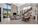 Open-concept living space featuring a fireplace, large windows, and access to a patio with mountain views at 6525 E Cave Creek Rd # 40, Cave Creek, AZ 85331