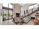 Bright living room boasts soaring ceilings, a fireplace, and access to a patio with mountain views at 6525 E Cave Creek Rd # 40, Cave Creek, AZ 85331
