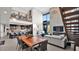 Bright living room boasts soaring ceilings, a fireplace, and a view of the kitchen area at 6525 E Cave Creek Rd # 40, Cave Creek, AZ 85331