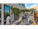 Inviting outdoor kitchen with a built-in grill, countertop seating, and lush green surroundings at 6525 E Cave Creek Rd # 40, Cave Creek, AZ 85331