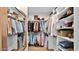 Organized walk-in closet with shelves and hanging rods, offering ample storage space for clothing and accessories at 6525 E Cave Creek Rd # 40, Cave Creek, AZ 85331