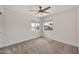 Bedroom featuring windows with natural light and plush carpeting at 664 E Windsor Dr, Gilbert, AZ 85296