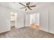 Bedroom with a ceiling fan, closet, and open doorway to the hallway at 664 E Windsor Dr, Gilbert, AZ 85296